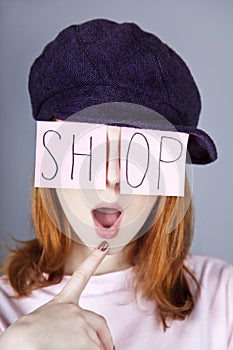 Fashion girl with SHOP word on eyes.