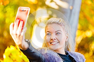 Fashion girl take selfie photo in autumn park