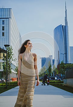 Fashion girl walking on streets. Walk on modern city street. City life. Woman in modern town. Street style vogue.