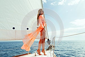 Fashion girl yachting in sea with blue sky sunlight