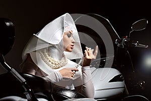 Fashion glamor stylish woman in sister of Mercy nun