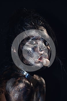 Fashion glamour portrait of a beautiful young caucasian woman. Black messy creative makeup. Dramatic dark image. The