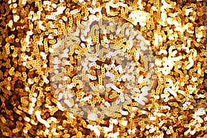 Fashion golden sequins, sparkling sequined textile. Gold background.