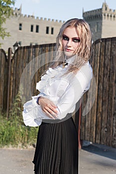 A fashion gothic style portrait of a beautiful blonde girl