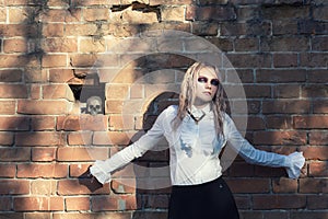 A fashion gothic style portrait of a beautiful blonde girl