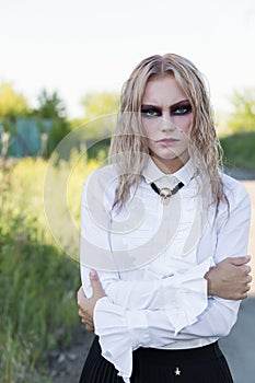 A fashion gothic style portrait of a beautiful blonde girl