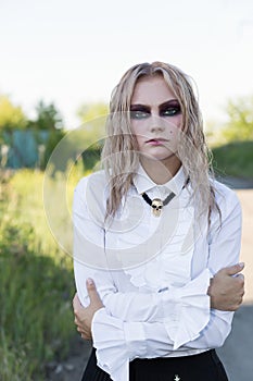 A fashion gothic style portrait of a beautiful blonde girl