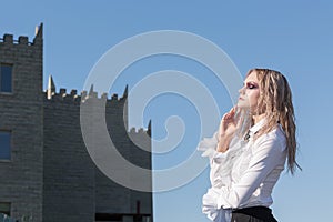 A fashion gothic style portrait of a beautiful blonde girl