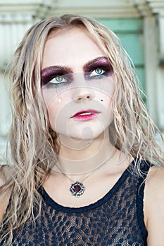 A fashion gothic style portrait of a beautiful blonde girl