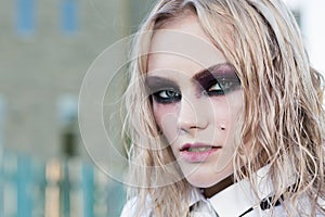 A fashion gothic style portrait of a beautiful blonde girl