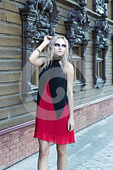 A fashion gothic style portrait of a beautiful blonde girl