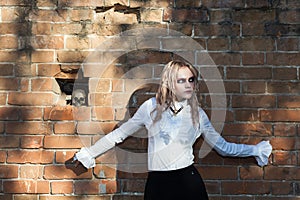 A fashion gothic style portrait of a beautiful blonde girl