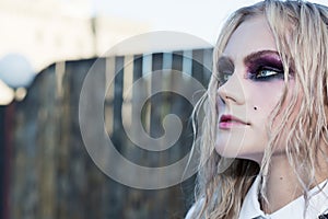 A fashion gothic style portrait of a beautiful blonde girl