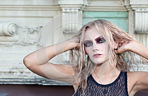 A fashion gothic style portrait of a beautiful blonde girl