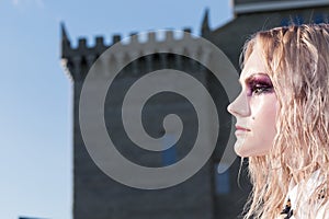 A fashion gothic style portrait of a beautiful blonde girl