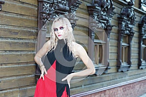 A fashion gothic style portrait of a beautiful blonde girl