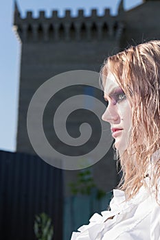 A fashion gothic style portrait of a beautiful blonde girl