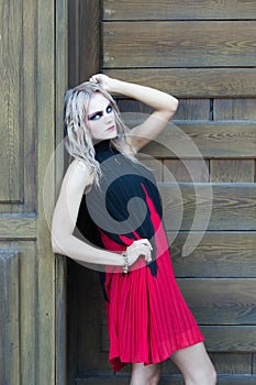 A fashion gothic style portrait of a beautiful blonde girl