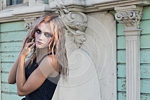 A fashion gothic style portrait of a beautiful blonde girl