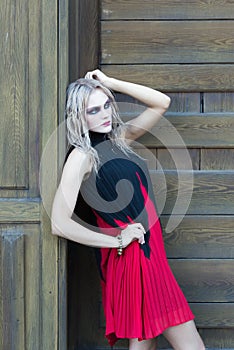 A fashion gothic style portrait of a beautiful blonde girl