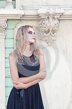 A fashion gothic style portrait of a beautiful blonde girl