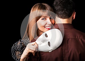 Fashion Happy Couple in Love holding with mask face