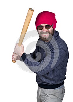 Fashion hipster cool man in sunglasses and colorful clothes brandishing a baseball bat