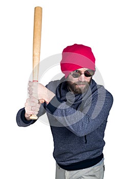 Fashion hipster cool man in sunglasses and colorful clothes brandishing a baseball bat