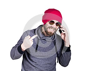 Fashion hipster cool man in sunglasses and colorful clothes, talking on the phone and express different emotions