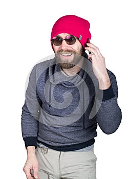 Fashion hipster cool man in sunglasses and colorful clothes talking on the phone. isolated on white background