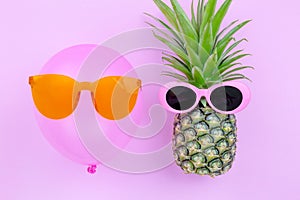 Fashion Hipster Pineapple and pink air balloon on pink color background, Bright Summer Color, Tropical Fruit with