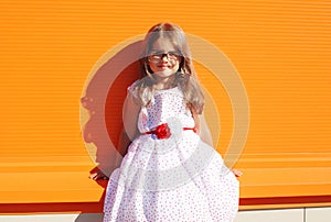 Fashion kid, portrait of beautiful little girl in white dress