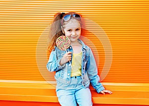 Fashion kid - stylish little girl child wearing a jeans clothes