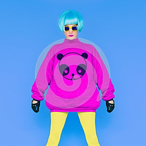 Fashion Lady loves panda. Funny photo. Girl in a bright wig on a