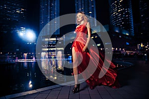 Fashion Lady In Red Dress And City Lights photo