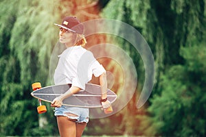 Fashion lifestyle, beautiful young woman with longboard