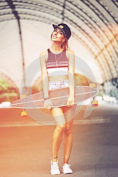 Fashion lifestyle, beautiful young woman with longboard