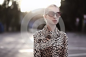 Fashion lifestyle portrait woman in sunglasses and dress