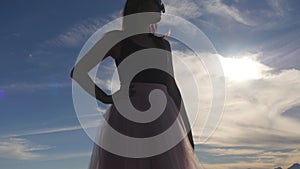 Fashion lifestyle portrait of young woman in tulle skirt