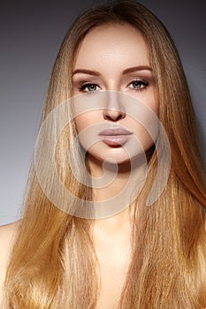 Fashion long hair. Beautiful blond girl. Healthy straight shiny hair style. Beauty woman model. Smooth hairstyle