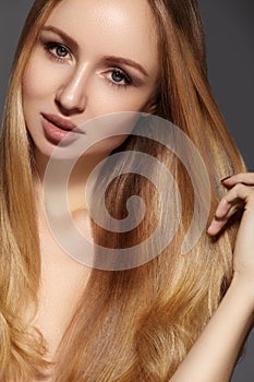 Fashion long hair. Beautiful blond girl. Healthy straight shiny hair style. Beauty woman model. Smooth hairstyle