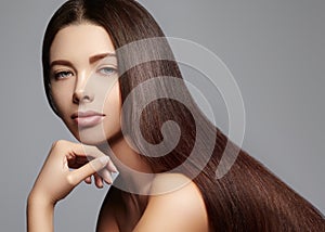 Fashion long hair. Beautiful brunette girl,. Healthy straight shiny hair style. Beauty woman model. Smooth hairstyle