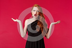 Fashion, luxury and beauty concept. Portrait of arrogant and frustrated young pretty redhead woman complaining on