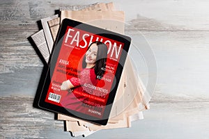 Fashion magazine cover on tablet photo