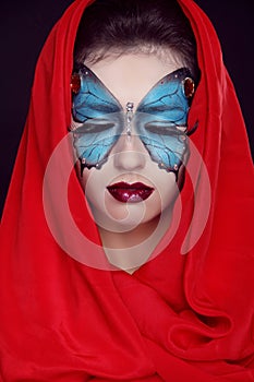Fashion Make up. Butterfly makeup on face beautiful woman. Art P