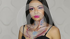 Fashion makeup. Woman with colorful makeup and body art