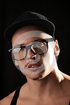 Fashion male in glasses looking at camera