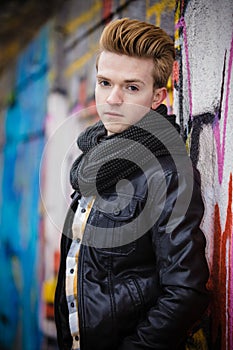 Fashion male portrait on graffiti wall