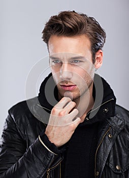 Fashion man face close up, over gray background