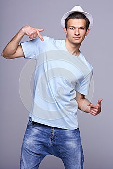 Fashion man pointing at himself